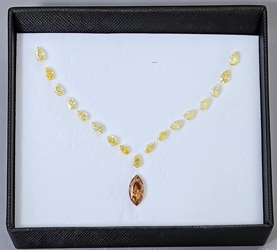 Loose fancy color diamonds collection featuring natural yellow, pink and orange diamonds