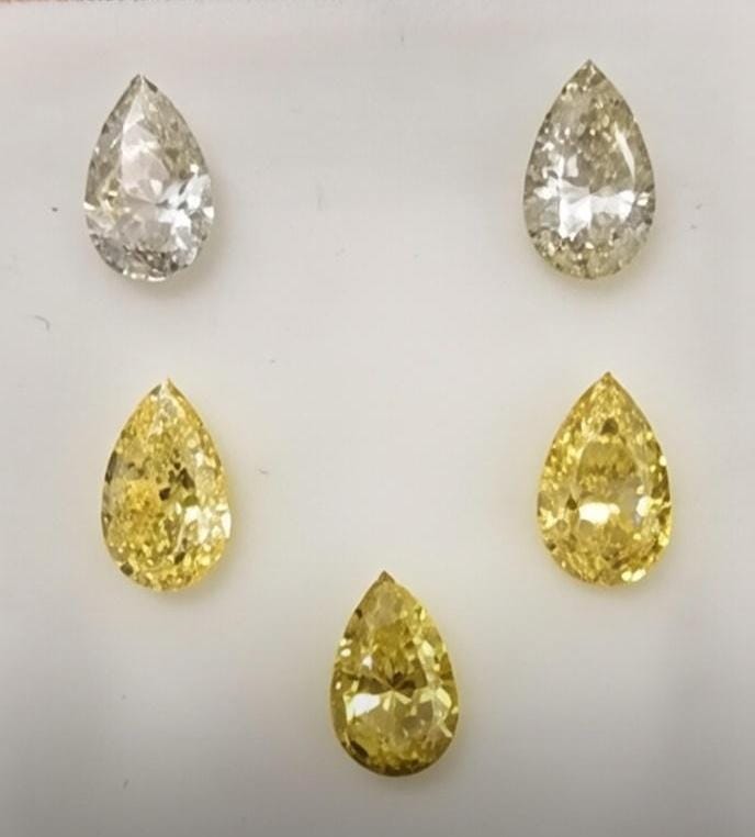 pear shaped yellow diamond stones displayed in five color intensities